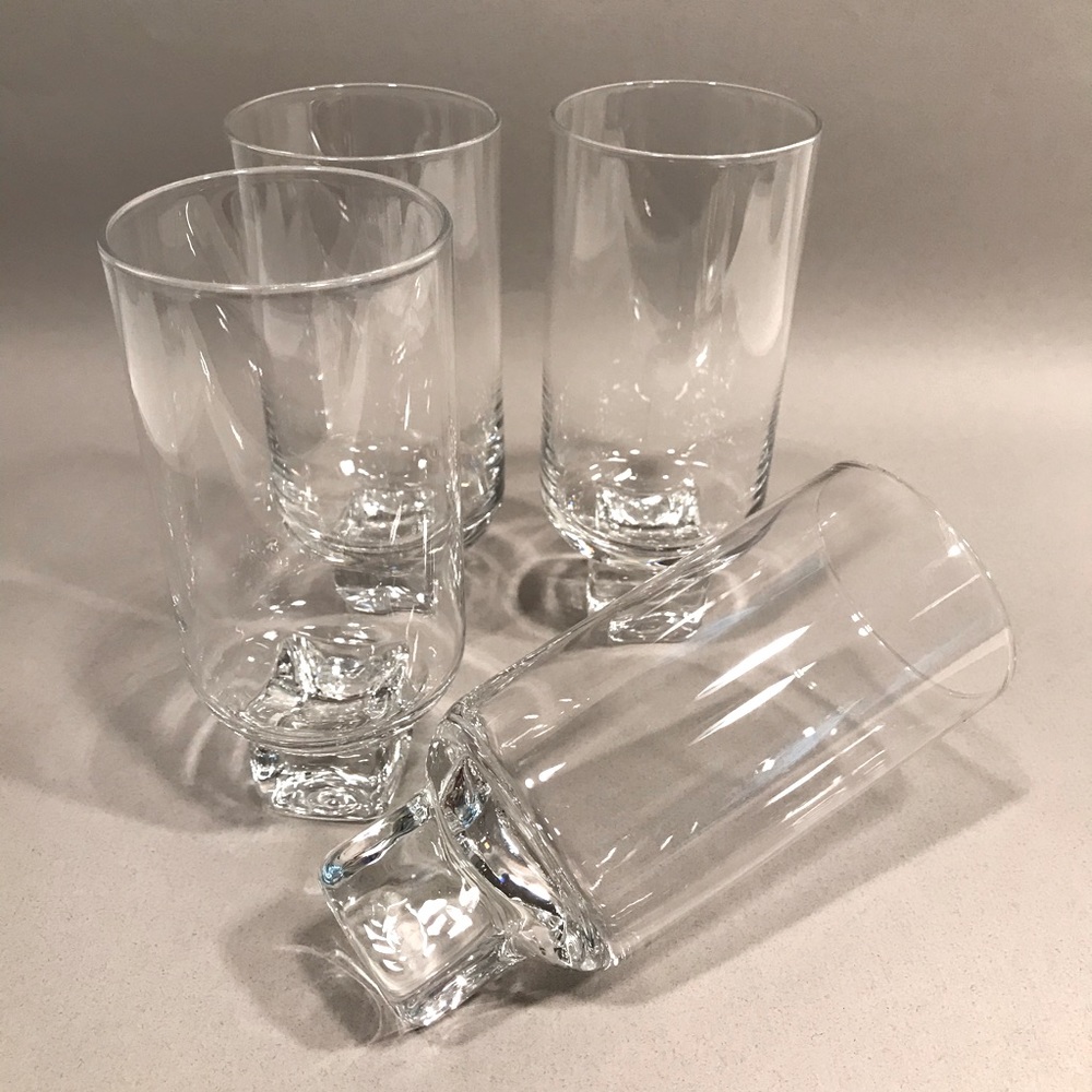 Set of four modern wine glasses with glass cube base